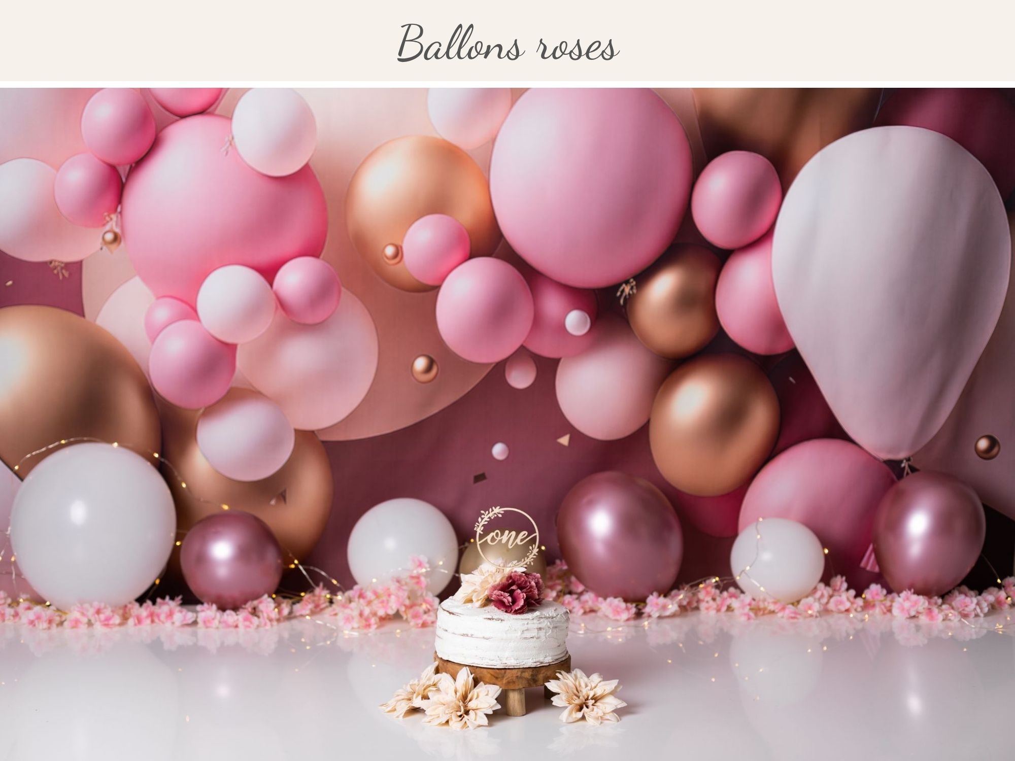 séance photo enfant sur fond décor ballons roses pétant